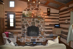 The fireplace and living room at Grindewald Swiss log cabin