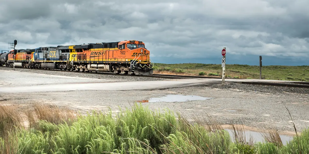 BNSF train on track at crossroads in middle America