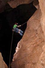 Rappeling down a 50' cliff to the bottom of the caverns