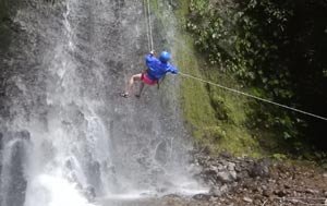 Costa Rica rappelling down a waterfall