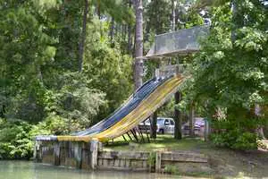 Slide at swimming lake at The Retreat at Artesian Lakes