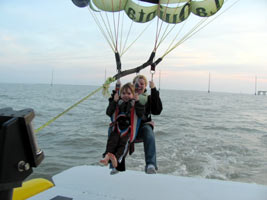 Grandson and daughter taking off on a parasail over Laguna Madre Bay