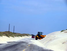 Never ending task to remove the sand off the road