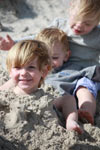 Covering the grand kids in the sand