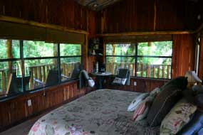 Comfortable bed  in the tree house at Cedar Mountain Lodge