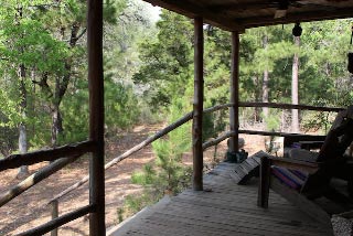the front porch of the best little cabin in texas