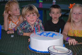 birthday boy and cake at Dell Diamond