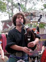 an entertainer playing the bagpipes at the Texas Renaissance Festival