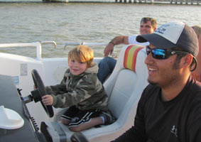 Grandson at the helm