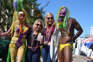 girls and boys at Mardi Gras wearing their beads